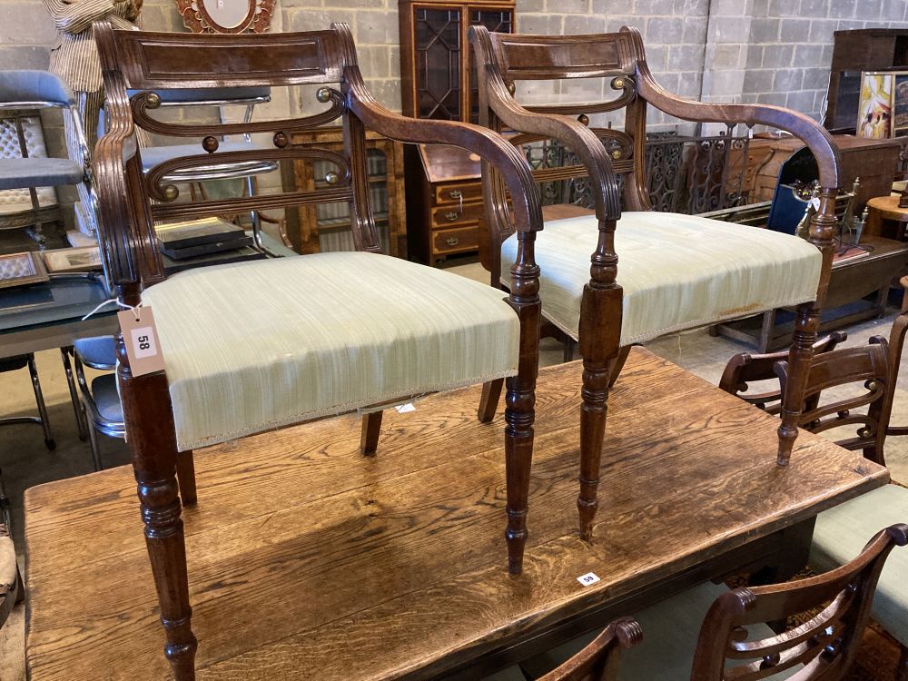 A set of eight Regency mahogany dining chairs (two with arms)